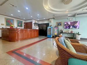 a living room with chairs and a cash register at Thipurai City Hotel in Hua Hin +154 photos