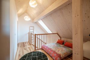 a bedroom with a bed in a attic at Ferienhaus Greith79 in Kitzeck im Sausal +22 photos