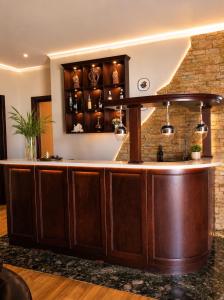 a bar in a room with a brick wall at Villa Kobuleti in Kobuleti