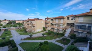 an overhead view of an apartment complex with a courtyard at Daniel Studios in Kallithea Halkidikis