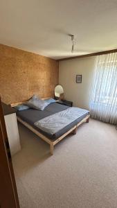 a bedroom with a large bed and a window at aba ZARA in Hamburg