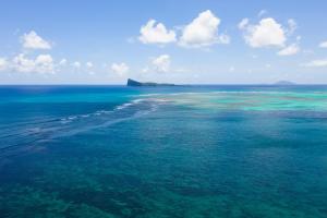an aerial view of an island in the ocean at Luxury Beachfront Apartment in Pereybere