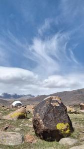 a large rock in the middle of a field at Old stones glamping in Chok-Tal