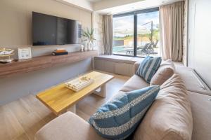 a living room with a couch and a coffee table at The Olive Path in Kalandra