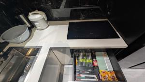 a counter top with a tablet computer on it at MONO HAUS Villa Danang in Danang