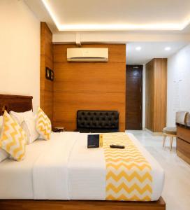 a bedroom with a large bed in a room at Hotel Good Will Residency - DLF Cyber City Gurgaon in Gurgaon +35 photos