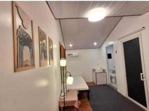 a room with a hallway with a table and a lamp at Yaga's Stay INN save in Impasugong