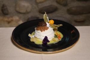 a dessert on a black plate on a table at Albergo Peluso in Altavilla Irpina
