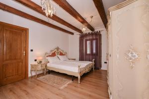 a bedroom with a bed and a wooden floor at House Polic in Hreljin +186 photos
