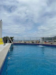 a large swimming pool with a water slide at Garden studio apartmans in Dobra Voda