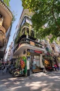 a building with motorcycles parked in front of it at Drift Backpackers Hostel in Hanoi