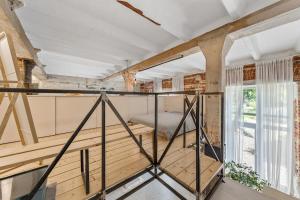 a room with a bed and a window at Raw Luxury Loft in Vilnius in Vilnius