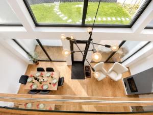 an overhead view of a living room with a chandelier at CBN Cabana in Muntele Cacovei