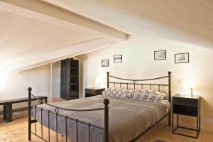a bedroom with a bed and two night stands at Casa Mia apartment in Vodnjan