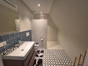 a bathroom with a sink and a toilet at Bed and Breakfast Reestdal in Meppel +66 photos