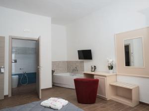 a bathroom with a tub and a sink at B&B La Via dei Mulini in Corigliano Calabro