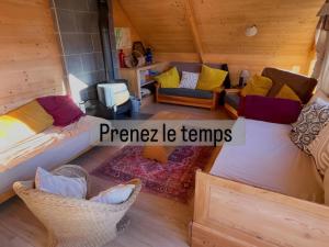 an overhead view of a room with two beds and chairs at Le Chalet Jarrier in Jarrier
