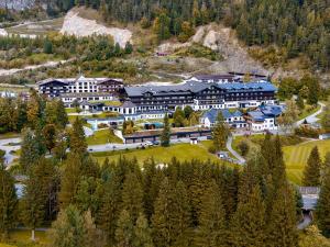 an aerial view of a resort in the mountains at Brandlhof lodge in Saalfelden am Steinernen Meer