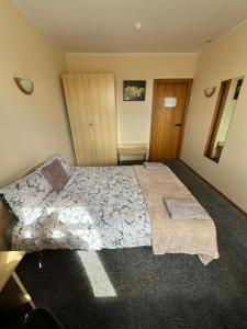 a bedroom with a large bed in a room at Vievija in Vievis