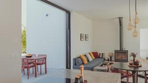 a living room with a couch and tables at Casa Pavone in Carovigno