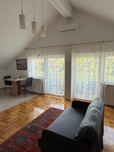a living room with a couch and a table at Mare in Generalski Stol