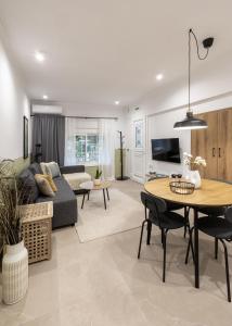 a living room with a couch and a table at Garden House Retreat-Suite in Drama
