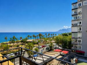 a view of the beach from a balcony of a building at Trend Park Hotel in Antalya