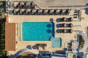 an aerial view of a resort with a swimming pool at Akti Dimis Hotel in Tigaki