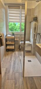 a bathroom with a tub and a sink at Casa Vacanza GERONIMI in San Cassiano +38 photos