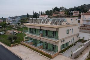 a building with four chairs on top of it at Asini deluxe suite 3, with rooftop terrace and breathtaking views in Asíni