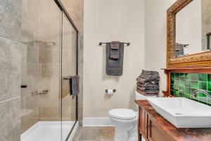a bathroom with a sink and a toilet and a shower at The Montgomery B&B in Starkville +28 photos