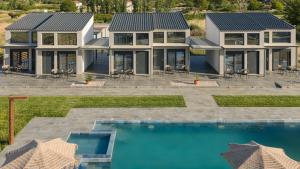 an aerial view of a house with a swimming pool at Mini Boutique Dragani in Sykia Chalkidikis
