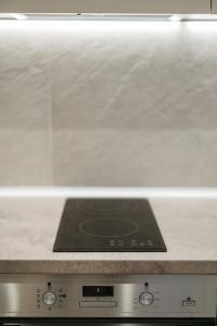 a stove top oven with a counter top at No7 Pool House in Iraklitsa