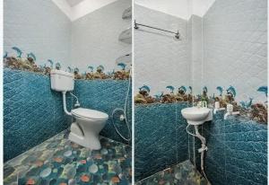 a bathroom with a toilet and some birds on the wall at Hotel Pink City& Banquet in Dīgha