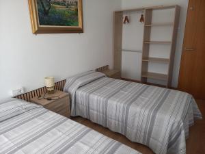 two beds sitting next to each other in a bedroom at Clot d'en Baldà in Berga