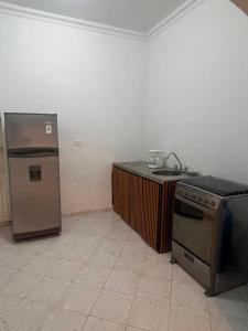 a kitchen with a stove and a sink at Casa Vacacional San Gil Santander in San Gil