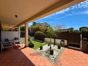 a view of a patio with a garden at VILLA SEASIDE HAVEN - Private Retreat with Garden in Anzio in Anzio