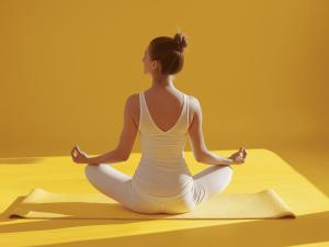 a woman sitting in a yoga pose on a mat at Rambaldi Apartments Casa nr 7 in Bardolino +20 photos