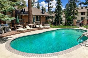 a large swimming pool in front of a house at Discovery 4 162 in Mammoth Lakes