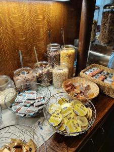 a table with plates of food and bowls of food at Hotel Veba in Broumov