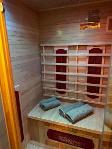 a sauna with two towels sitting on a shelf at La suite 44 in Le Locle