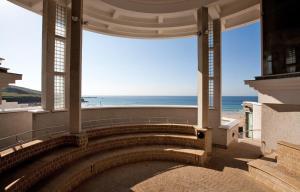 a building with a staircase with a view of the ocean at 2 Bed in St. Ives oc-r28154 in St Ives