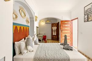 a bedroom with a large bed in a room at Riad Dar Hamid Hotel & Spa in Marrakesh +59 photos