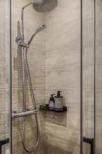a shower with a glass door in a bathroom at Lux PIGALLE in Argenteuil +36 photos