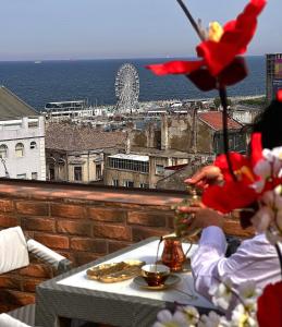 a table with food and a view of the ocean at Belle Epoque Boutique (Adult Only) in Constanţa