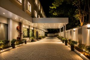 a hallway of a building at night with lights at Hotel Indraprasttha in Vijayawāda