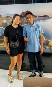 a man and a woman posing for a picture at Hana hostel in Labuan Bajo