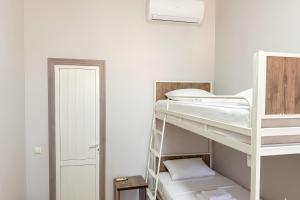 a room with two bunk beds and a door at BESQALA in Nukus