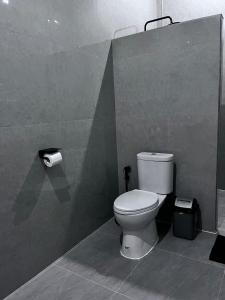 a bathroom with a toilet and a roll of toilet paper at Jou Trekking Guesthouse in Senaru +40 photos