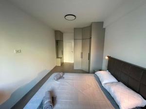 a room with a large bed in the middle at BD Luxury Apartment in Bitola